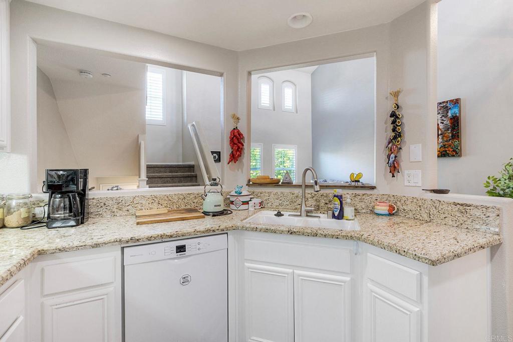 40238 Rosewell Court Temecula, CA 92591 - Photo 14 of 38 a bathroom with double sink and a mirror