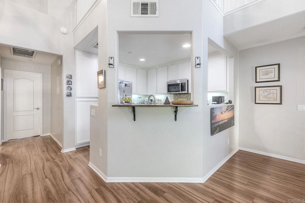 40238 Rosewell Court Temecula, CA 92591 - Photo 16 of 38 a view of kitchen and wooden floor