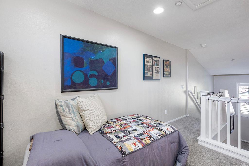 40238 Rosewell Court Temecula, CA 92591 - Photo 24 of 38 a bedroom with a bed and a painting on the wall