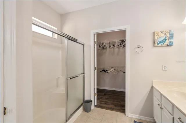 a bathroom with a shower and a shower