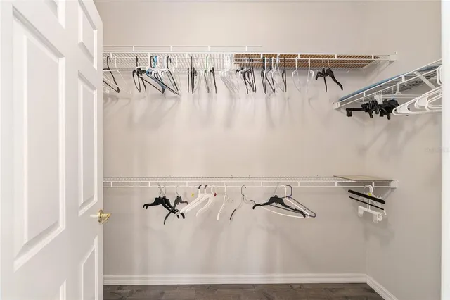 a bedroom with a bed and a table