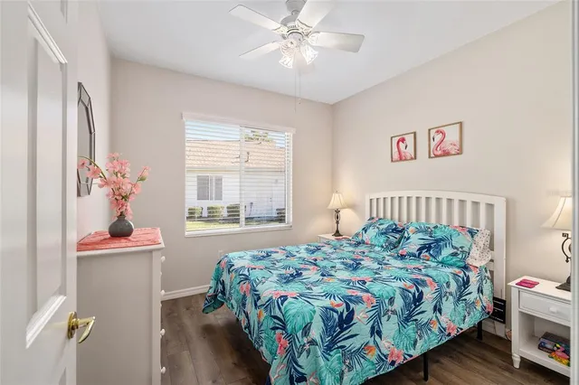 a bedroom with a bed and a dresser in it