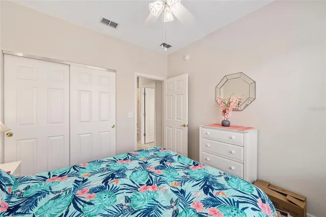 a bathroom with a sink vanity mirror and toilet
