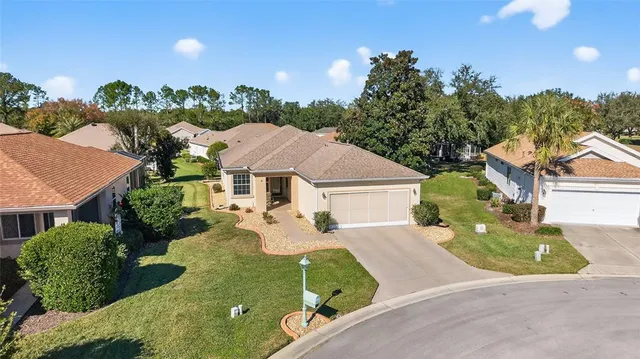 an aerial view of a house with a garden