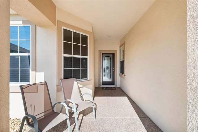a view of workspace with wooden floor and windows