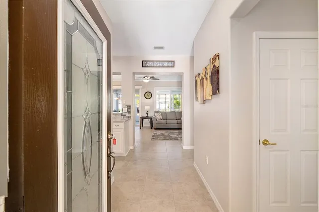 a view of a hallway with living room and furniture