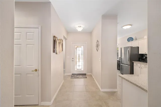 a view of a hallway with a living room