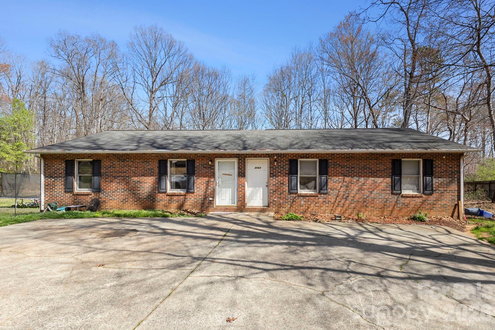 4562 Grassy Creek Road Denver, NC 28037 - Photo 1 of 24 a front view of a house with a yard