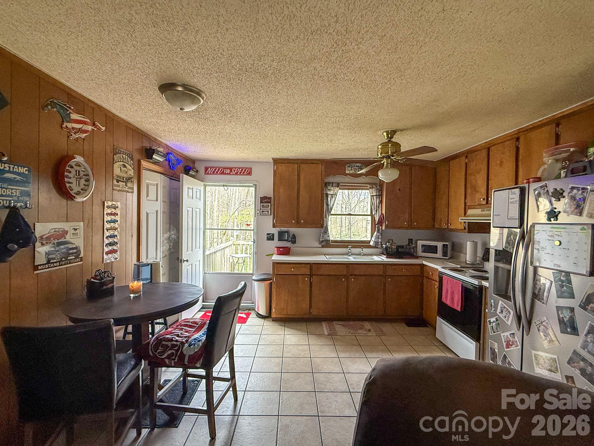 4562 Grassy Creek Road Denver, NC 28037 - Photo 20 of 24 a kitchen with stainless steel appliances granite countertop a sink and cabinets