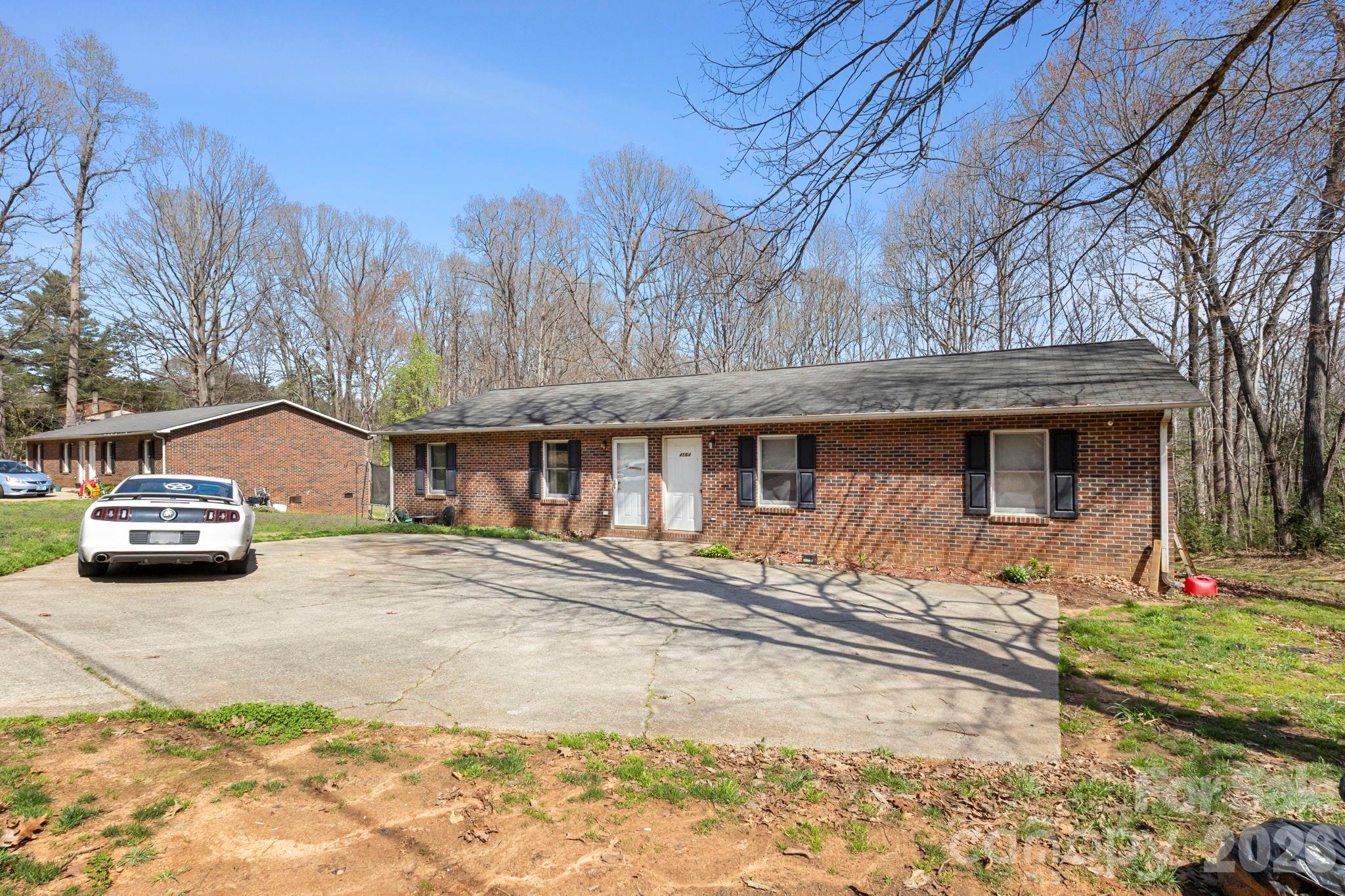 4562 Grassy Creek Road Denver, NC 28037 - Photo 3 of 24 a front view of a house with a yard