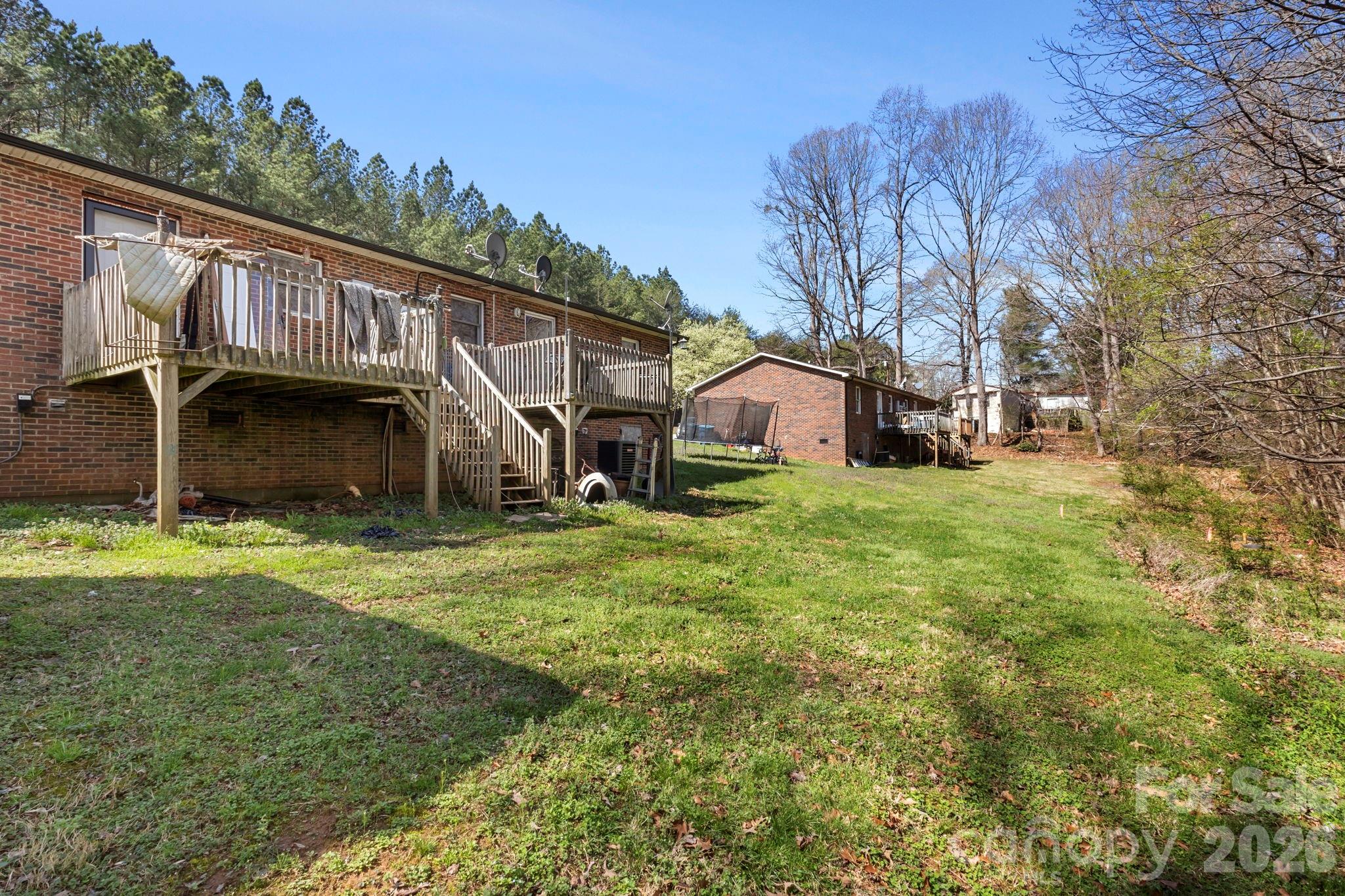 4562 Grassy Creek Road Denver, NC 28037 - Photo 5 of 24 a view of backyard with deck and garden