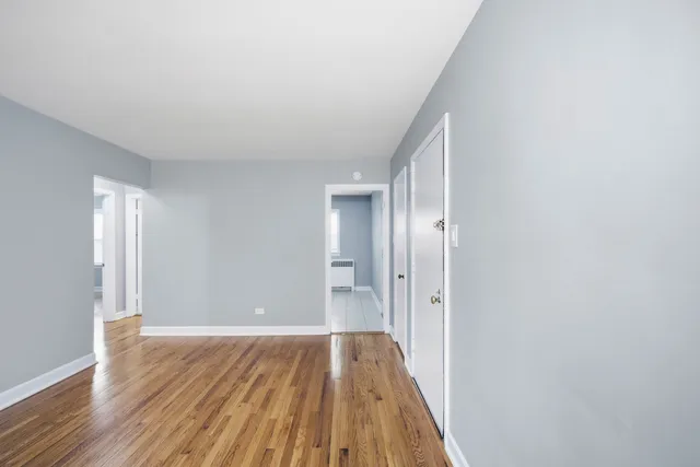 a view of wooden floor in an empty room