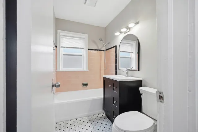 a bathroom with a sink toilet and bathtub