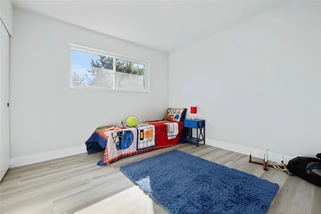 a room with toys and a wooden floor