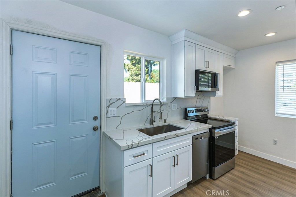 2013 Walnut Street La Verne, CA 91750 - Photo 1 of 1 a kitchen with a sink and a stove top oven