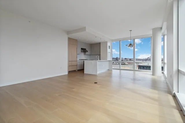 a view of a kitchen with wooden floor