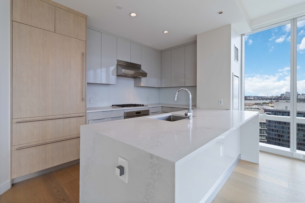 188 Brookline Avenue, Unit 20J Boston, MA 02215 - Photo 6 of 29 a kitchen with stainless steel appliances a sink a stove and a refrigerator