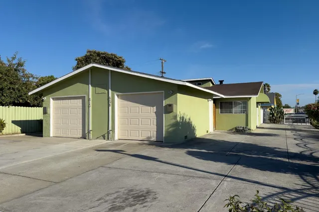 a front view of a house with garage
