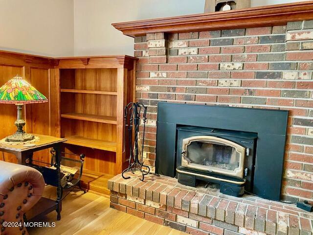 732 Radcliffe Road Lanoka Harbor, NJ 08734 - Photo 17 of 67 a living room with furniture a flat screen tv and a fireplace