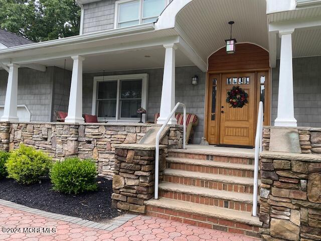 732 Radcliffe Road Lanoka Harbor, NJ 08734 - Photo 4 of 67 a front view of a house with a porch