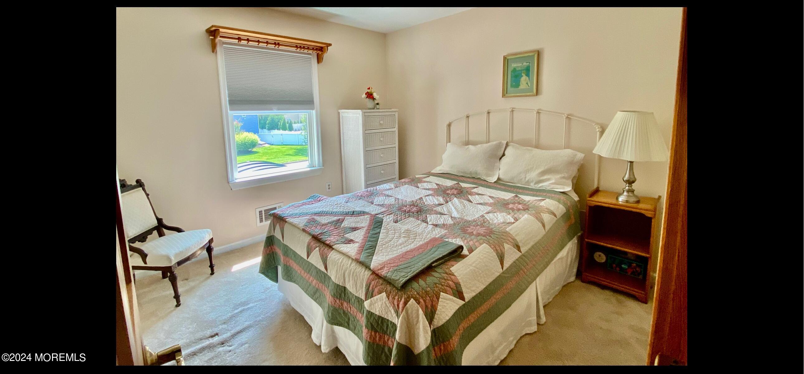 732 Radcliffe Road Lanoka Harbor, NJ 08734 - Photo 42 of 67 a bed sitting in a bedroom next to a window