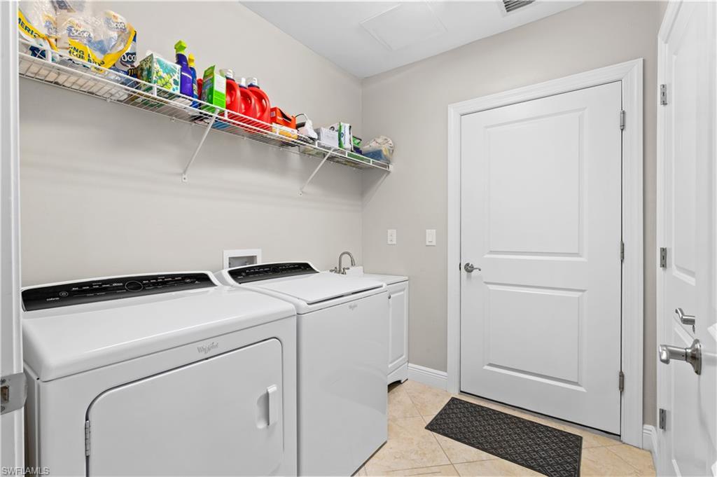 10470 Casella Way, Unit 101 Fort Myers, FL 33913 - Photo 18 of 20 a utility room with dryer and washer