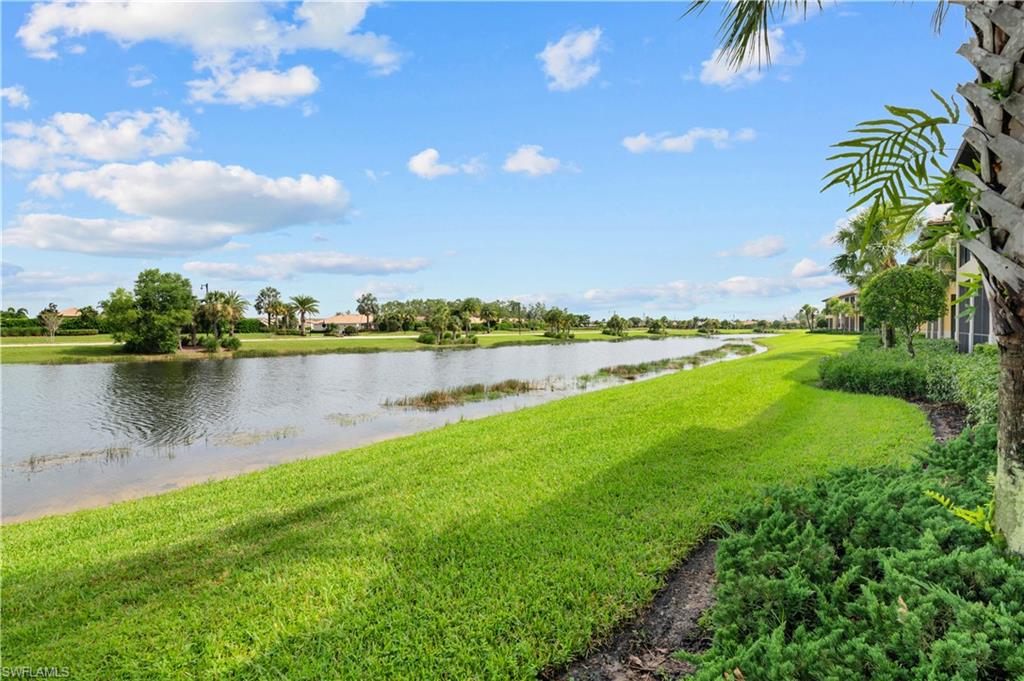 10470 Casella Way, Unit 101 Fort Myers, FL 33913 - Photo 20 of 20 a view of a lake with houses in the back