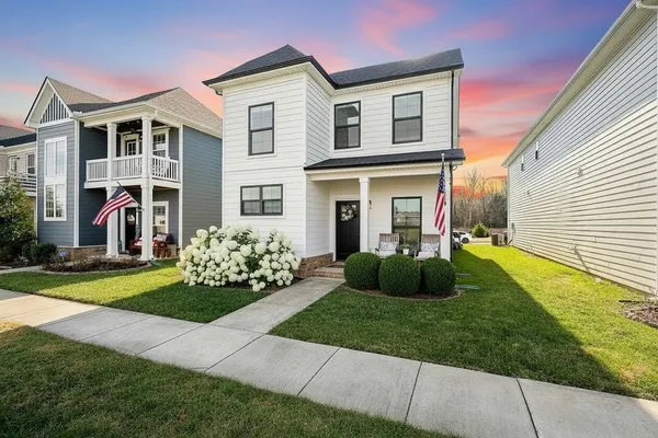 a front view of a house with a yard