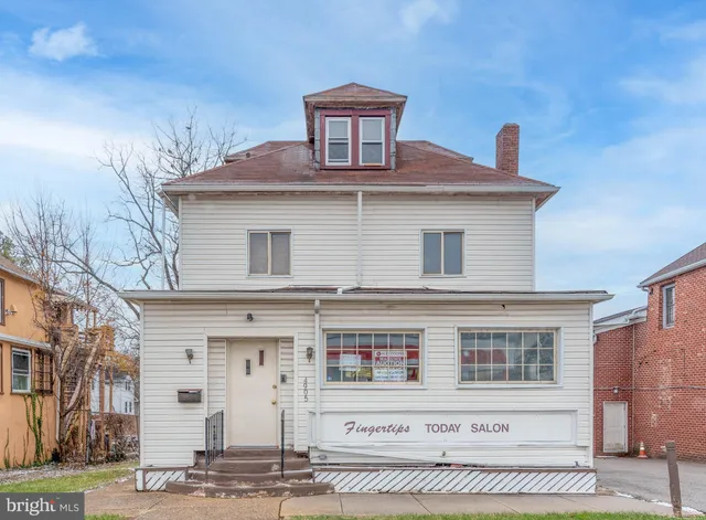 a front view of a house with a garage