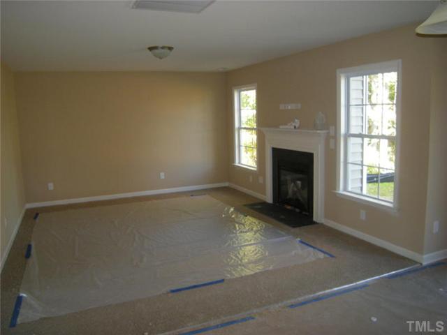 5801 Abbington Way Raleigh, NC 27610 - Photo 4 of 10 Living room with gas fireplace