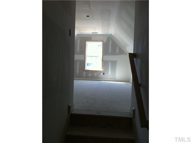 5801 Abbington Way Raleigh, NC 27610 - Photo 7 of 10 split stair case on second floor! One set leads to the 4th BR the other set to the master, BR2 and BR3!