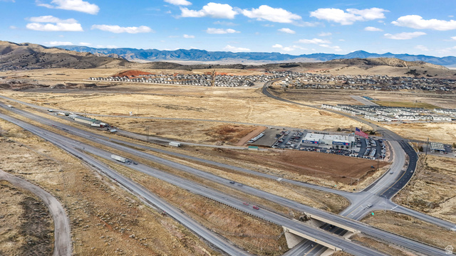 15371 Frontage Road Santaquin, UT 84655 - Photo 7 of 18 Drone / aerial view of a mountainous background and a desert landscape
