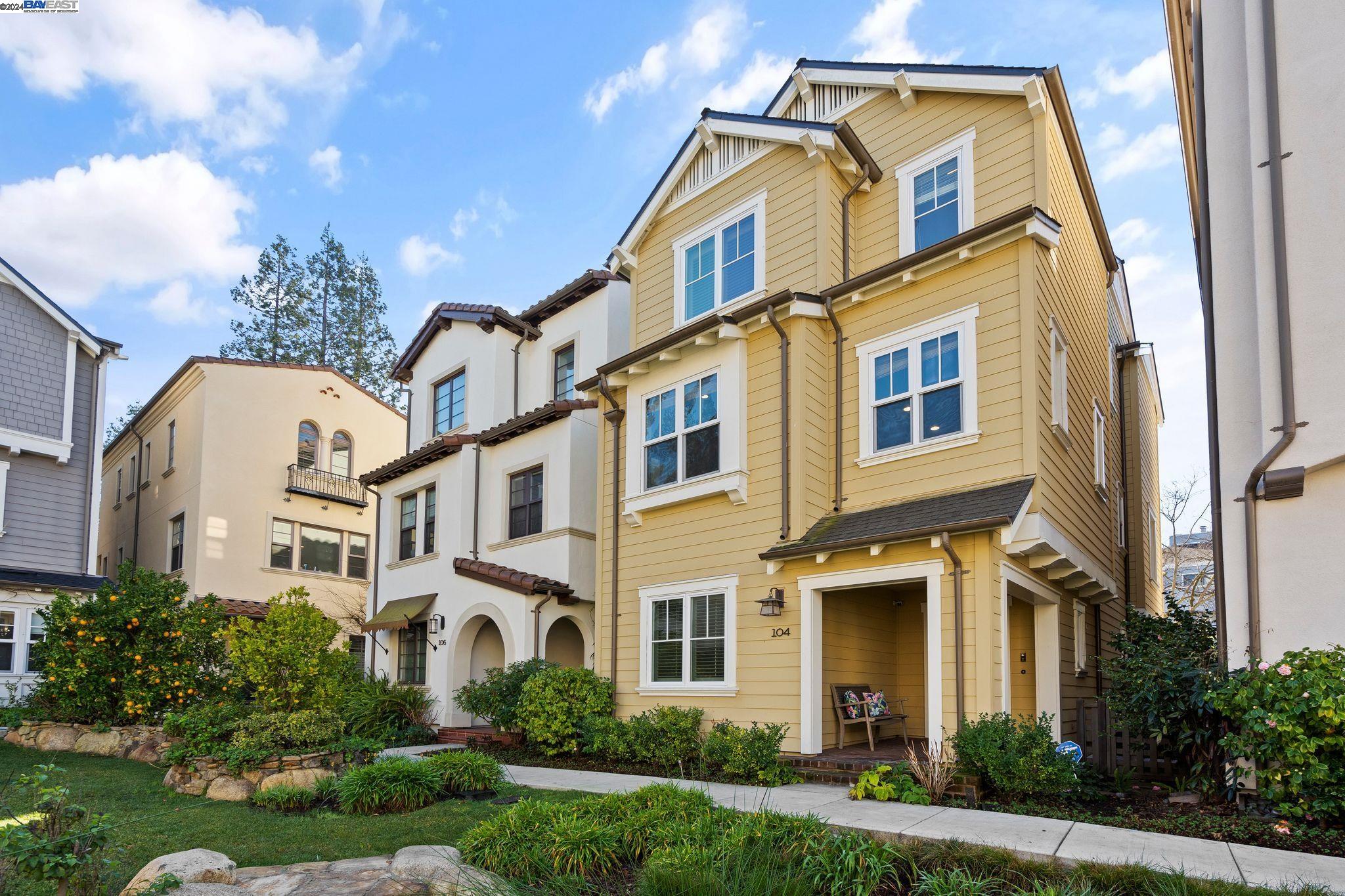 104 Savannah Loop Mountain View, CA 94043 - Photo 1 of 1 a front view of a multi story residential apartment building with yard and parking