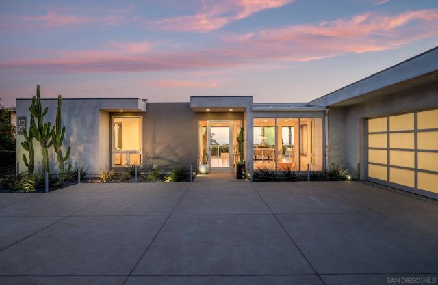 a view of a house with a street