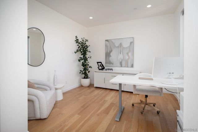 a bathroom with a sink a mirror and a shower