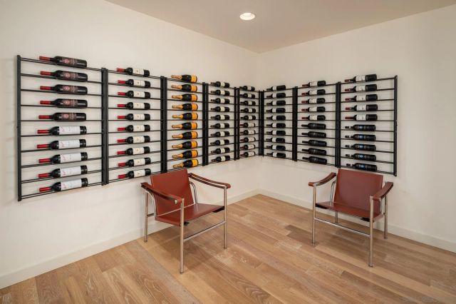 a picture of wooden floor in a hall with an empty room