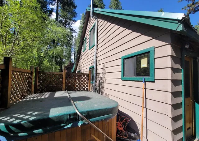 a view of a house with a backyard
