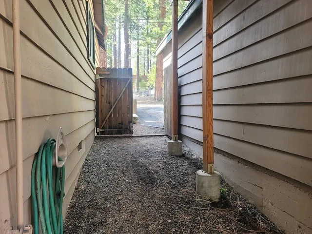 a view of a chairs and table in the balcony