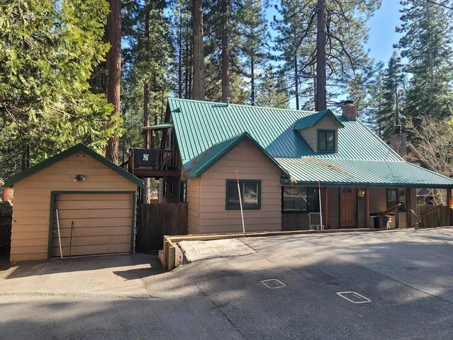 a house with trees in the background