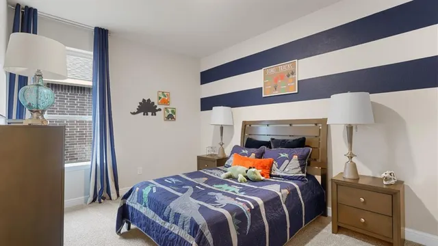 a bed room with a bed and a painting on the wall