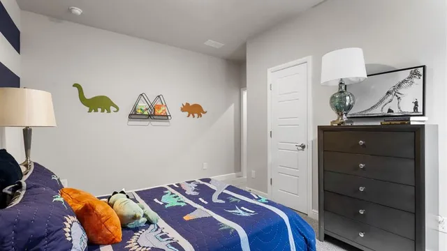 a bedroom with a bed and a mirror