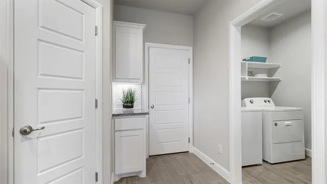 a kitchen with granite countertop a sink stove and refrigerator