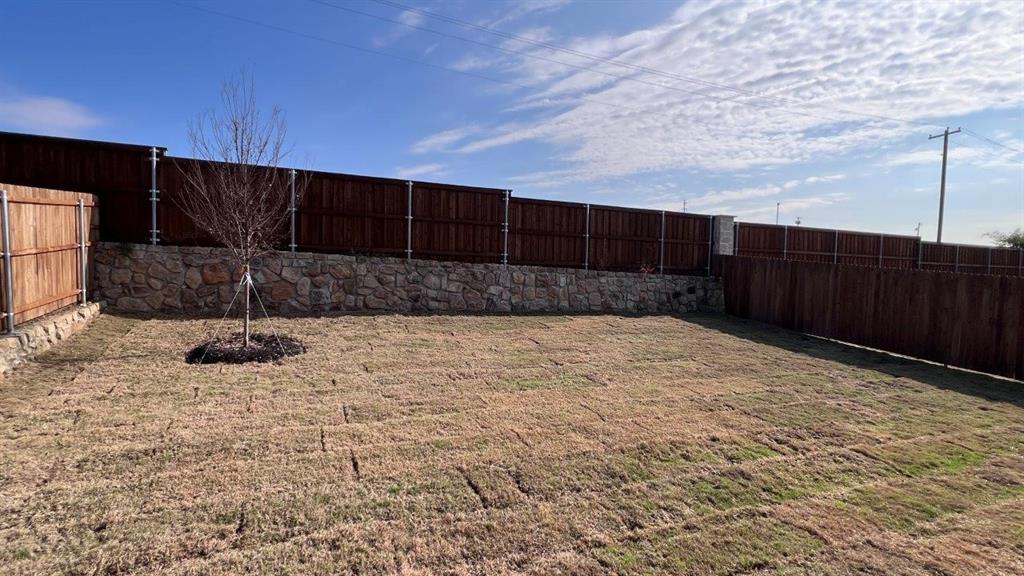 129 Medina Lane Rhome, TX 76078 - Photo 12 of 13 a view of a backyard of the house
