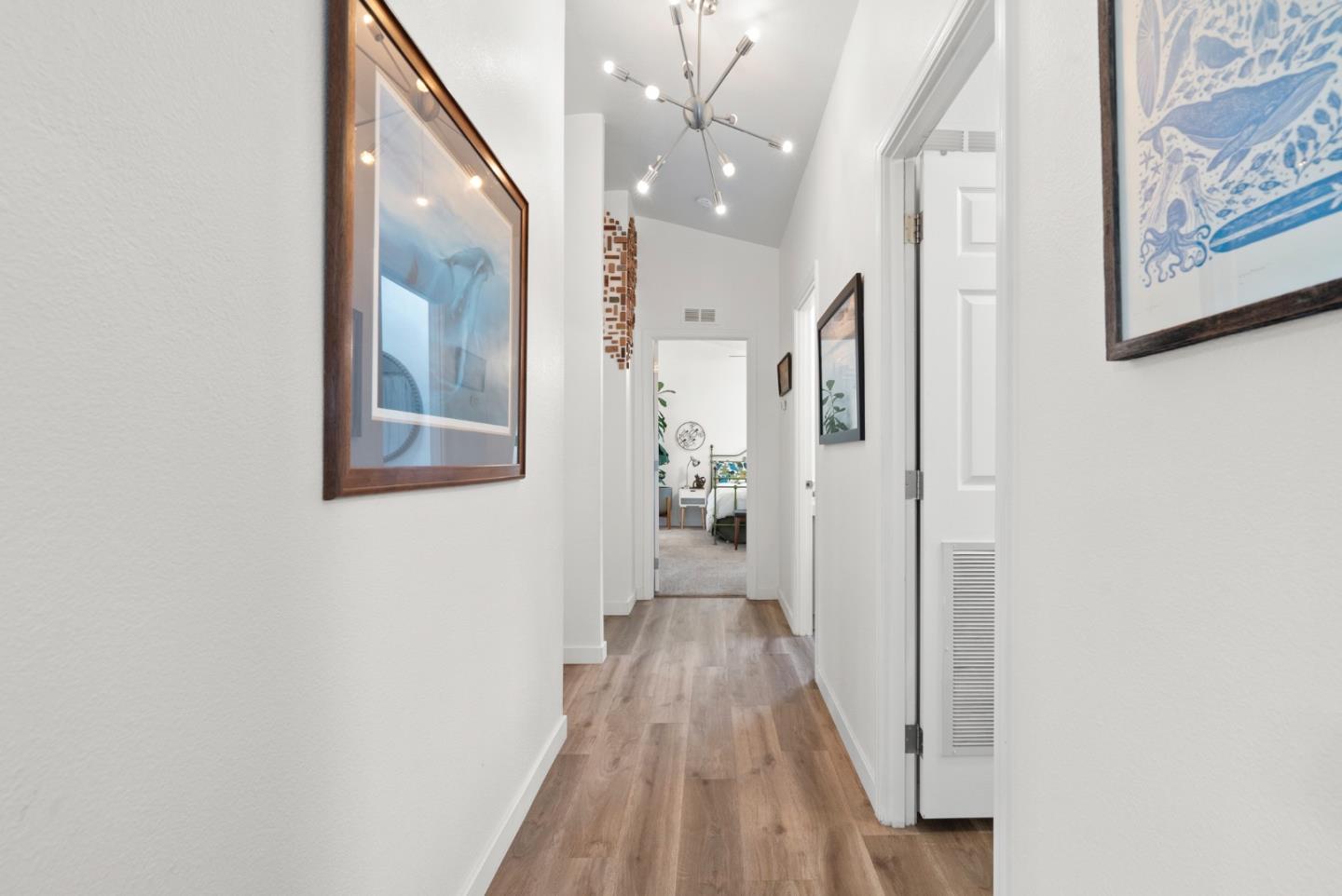 2395 Delaware Avenue, Unit 88 Santa Cruz, CA 95060 - Photo 13 of 55 a view of a hallway with wooden floor and staircase