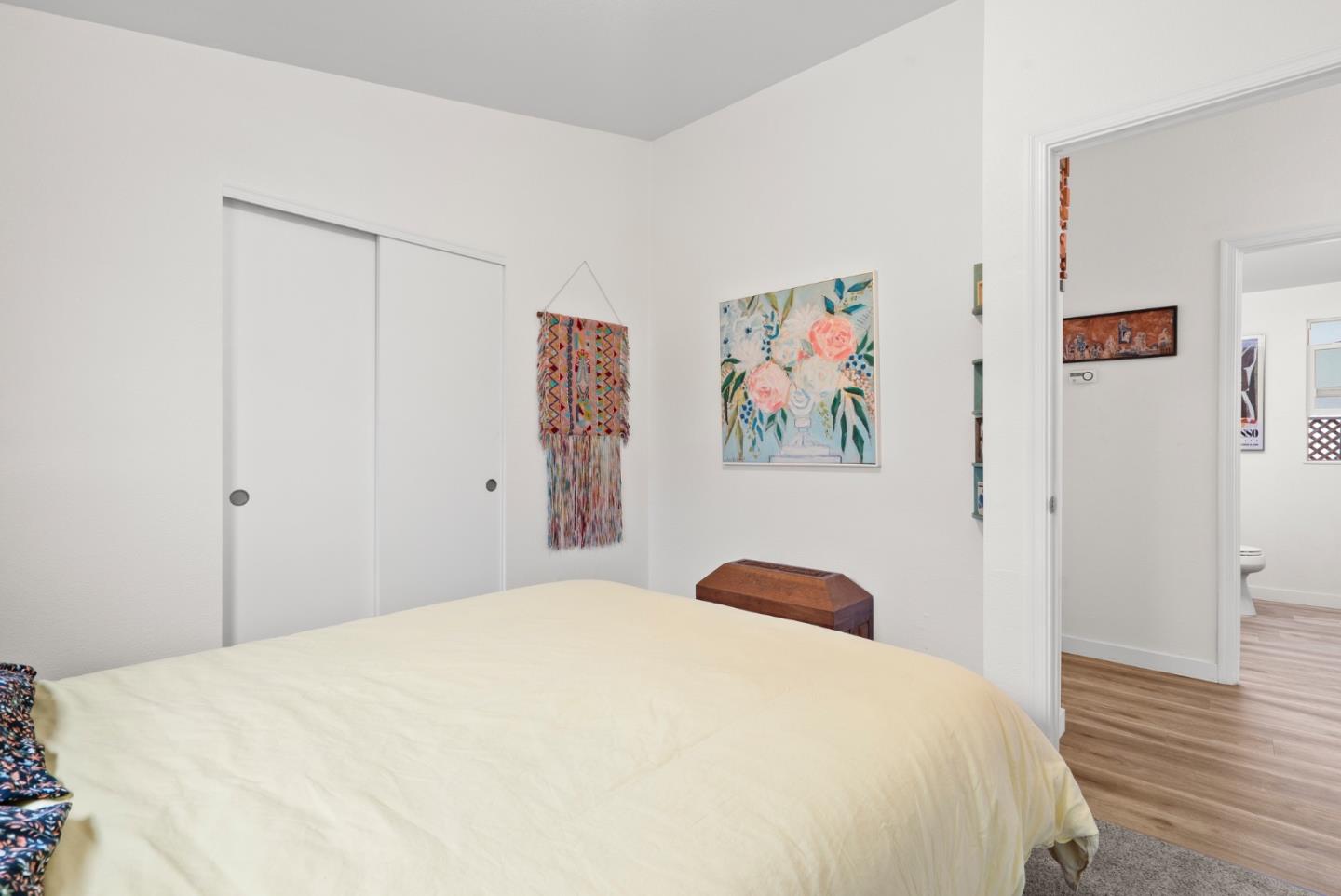 2395 Delaware Avenue, Unit 88 Santa Cruz, CA 95060 - Photo 22 of 55 a bedroom with a bed and a painting on the wall