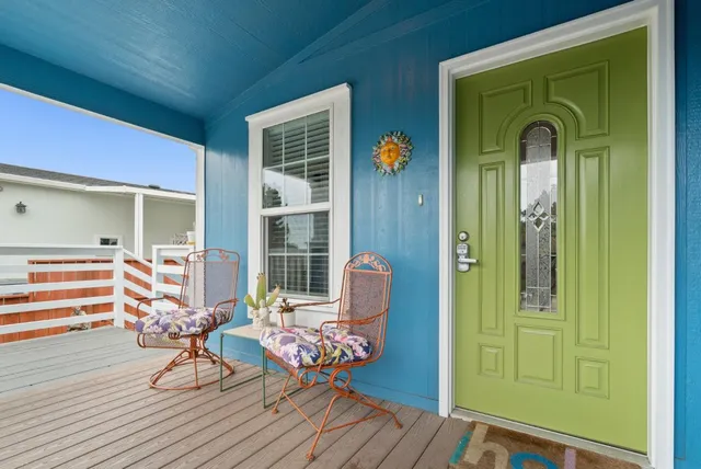 a view of a chairs and table in the patio