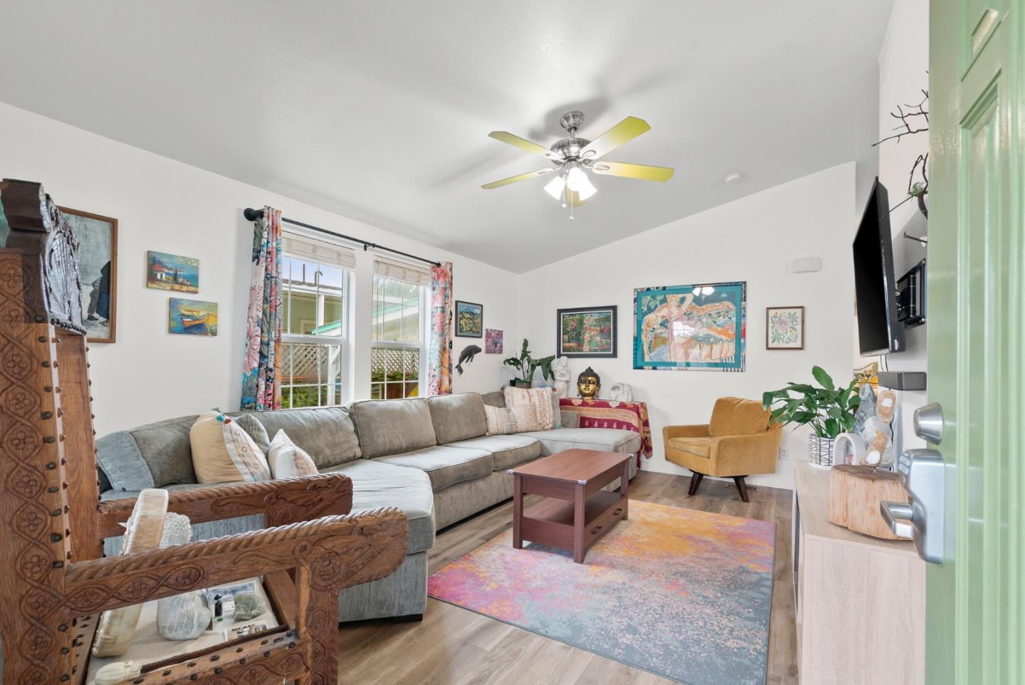 2395 Delaware Avenue, Unit 88 Santa Cruz, CA 95060 - Photo 3 of 55 a living room with furniture flowerpot and a chandelier