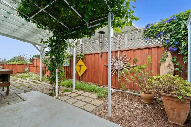 a view of a backyard with a sitting area