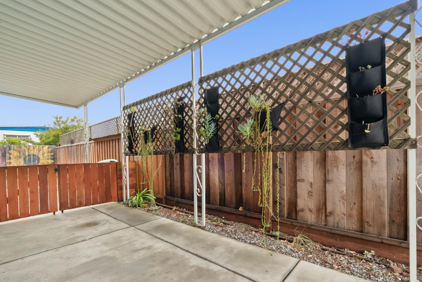 2395 Delaware Avenue, Unit 88 Santa Cruz, CA 95060 - Photo 35 of 55 a backyard of a house with bicycles parked and wooden fence