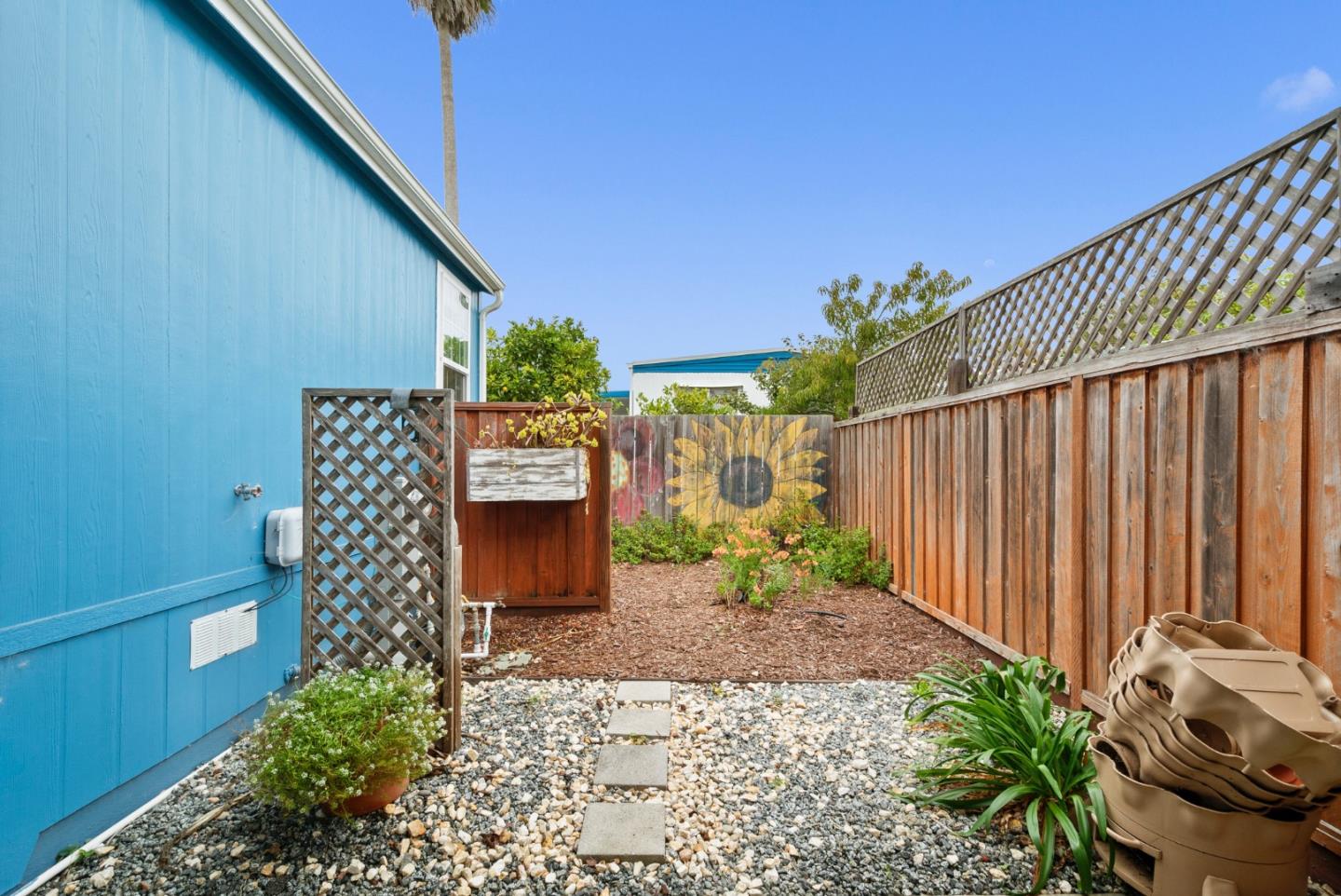 2395 Delaware Avenue, Unit 88 Santa Cruz, CA 95060 - Photo 37 of 55 a view of a chair and table in the patio